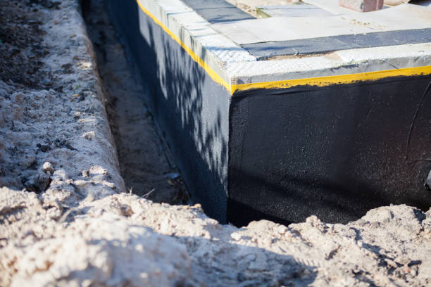 Professional Basement Waterproofing technician working in Lutts, TN